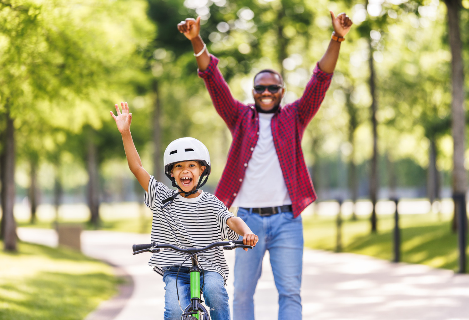 Happy,Family,Father,Teaches,Boy,Son,To,Ride,Bike,In